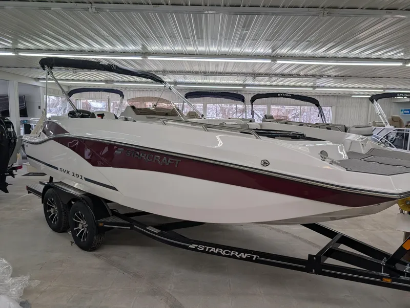 The Image of 2025 Starcraft SVX 191 OB boat in showroom on trailer. - 0
