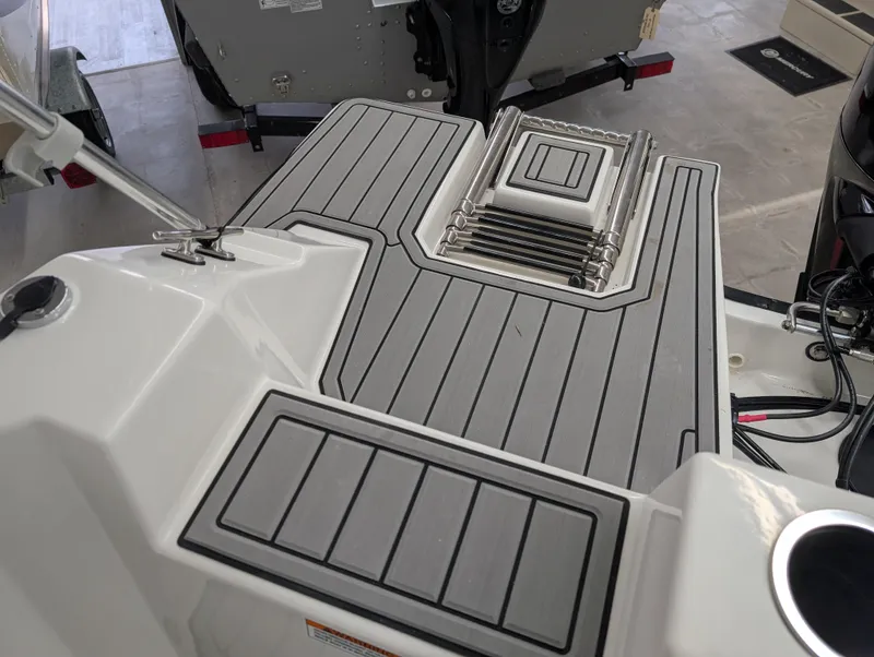 Slide: The Image of 2025 Starcraft SVX 191 OB boat deck with sleek, modern design and non-slip surface. - 11