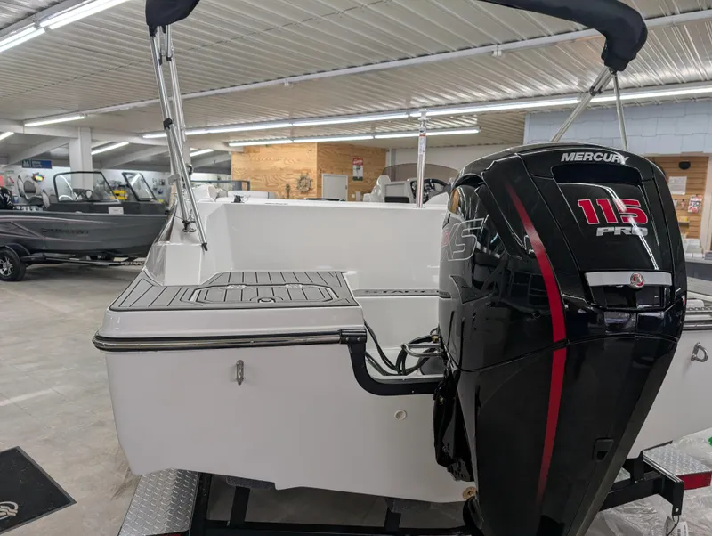 Slide: The Image of 2025 Starcraft SVX 191 OB boat with Mercury 115 engine in showroom. - 12
