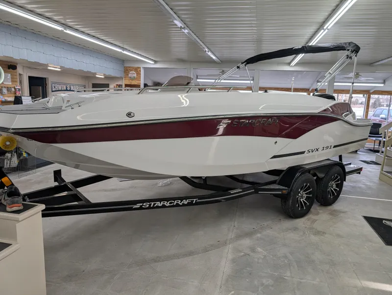 Slide: The Image of 2025 Starcraft SVX 191 OB boat on trailer in showroom. - 2