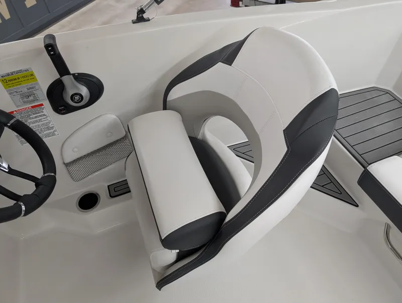 Slide: The Image of 2025 Starcraft SVX 191 OB boat interior with sleek white and black seating. - 9