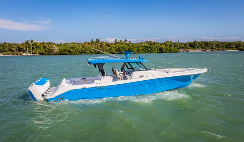 Slide: The Image of 2025 HCB 48 Campeon boat cruising on a sunny day. - 0