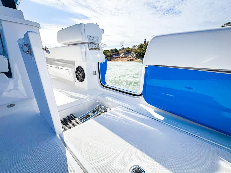 Slide: The Image of 2025 HCB 48 Campeon boat interior with sleek white and blue design. - 13