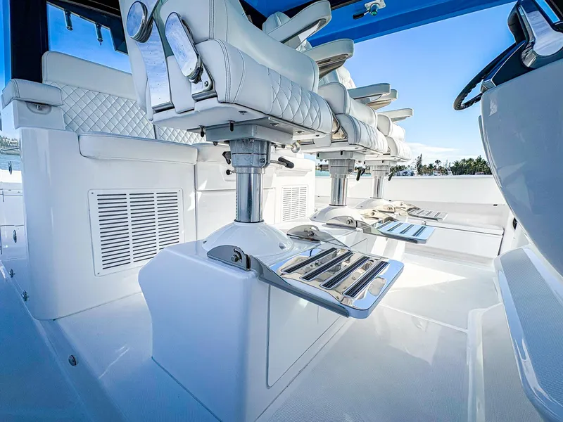 Slide: The Image of Luxury seating on 2025 HCB 48 Campeon boat, featuring sleek white design and modern amenities. - 19