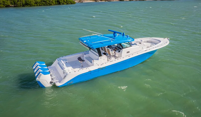 Slide: The Image of 2025 HCB 48 Campeon boat in vibrant blue on open water. - 2