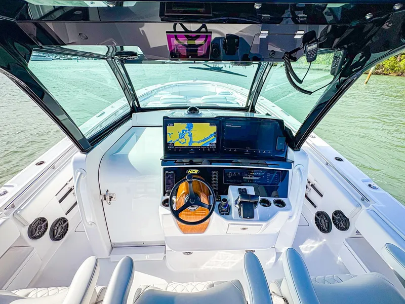 Slide: The Image of 2025 HCB 48 Campeon boat cockpit with advanced navigation system and sleek design. - 21