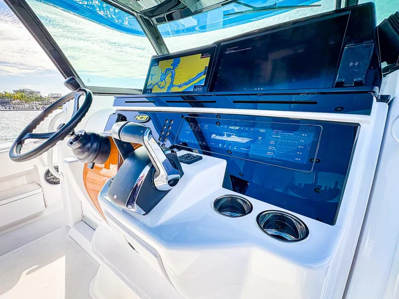 Slide: The Image of 2025 HCB 48 Campeon boat dashboard with advanced navigation and control systems. - 22