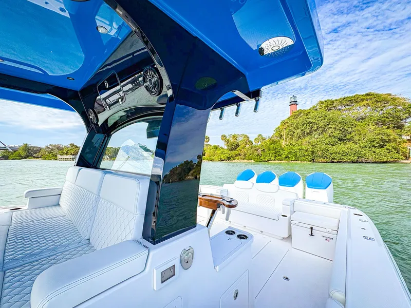 Slide: The Image of 2025 HCB 48 Campeon luxury boat interior with scenic water and lighthouse view. - 25