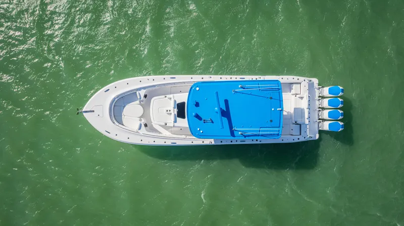 Slide: The Image of Aerial view of 2025 HCB 48 Campeon boat on green water. - 3