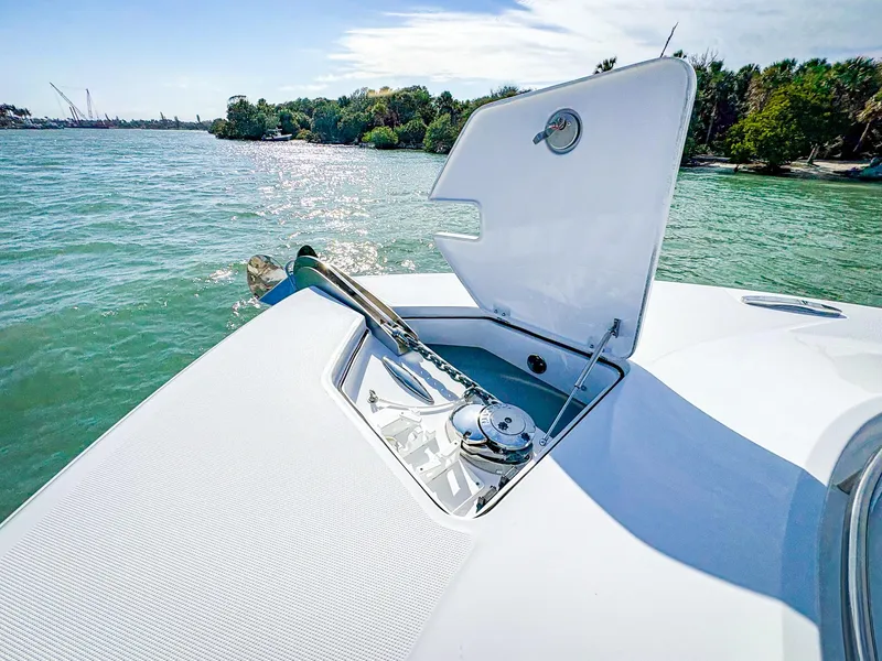 Slide: The Image of 2025 HCB 48 Campeon boat with open anchor hatch on a sunny day. - 30