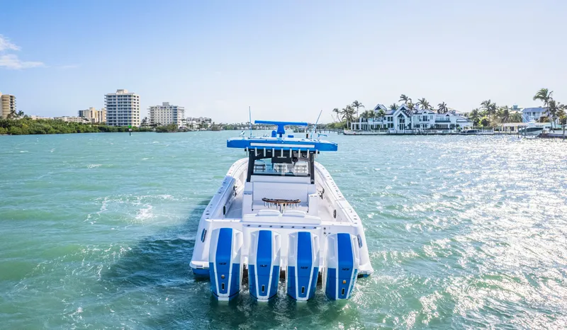 Slide: The Image of 2025 HCB 48 Campeon boat cruising in sunny coastal waters. - 40