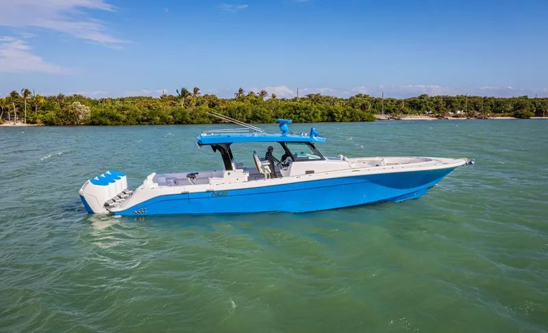 Slide: The Image of 2025 HCB 48 Campeon boat cruising on a sunny day in tropical waters. - 43