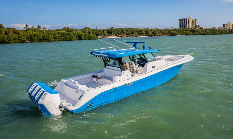 Slide: The Image of 2025 HCB 48 Campeon boat cruising on a sunny day in calm waters. - 44