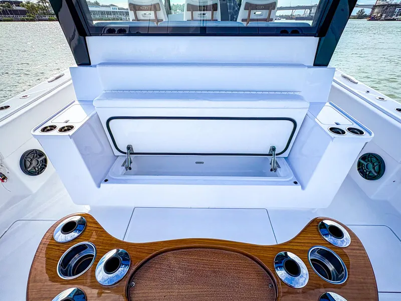 Slide: The Image of 2025 HCB 48 Campeon boat interior with sleek seating and cup holders. - 8