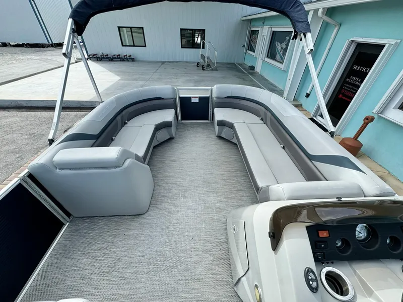 Slide: The Image of 2020 Bennington 22SSXAPG pontoon boat interior with spacious seating and modern dashboard. - 15