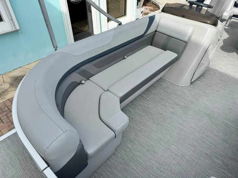 Slide: The Image of 2020 Bennington 22SSXAPG pontoon boat interior with gray seating and carpeted flooring. - 19