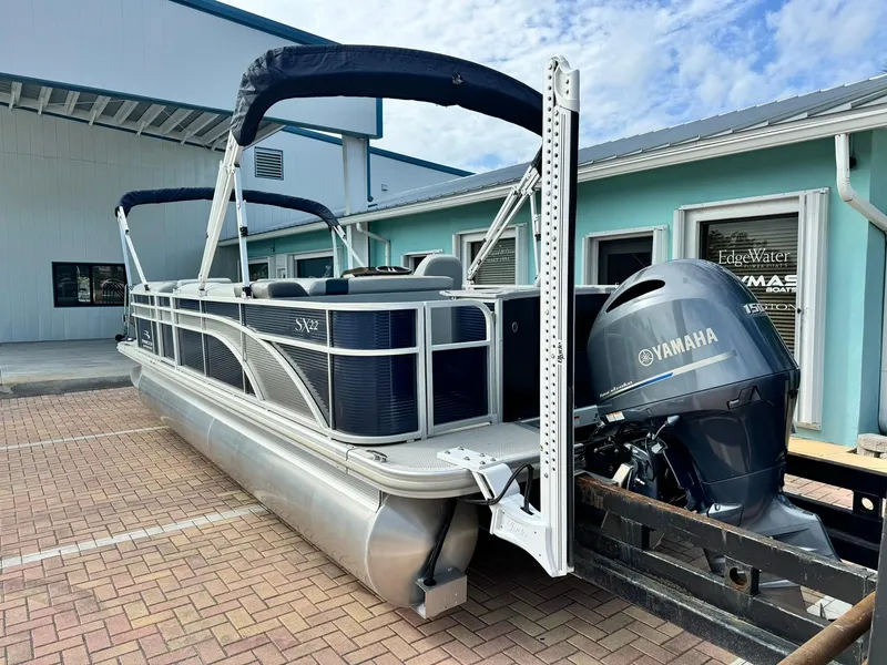 Slide: The Image of 2020 Bennington 22SSXAPG pontoon boat with Yamaha engine, parked on brick pavement. - 5