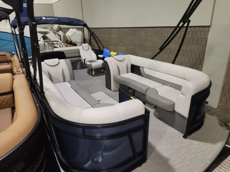 Slide: The Image of 2025 Godfrey Monaco 255 SFL pontoon boat with spacious seating and modern design. - 2