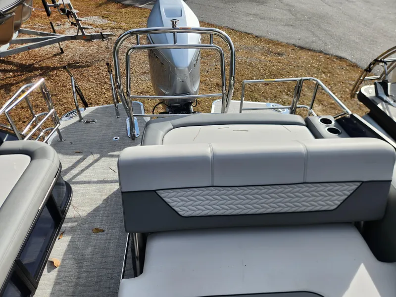 Slide: The Image of 2025 Godfrey Monaco 255 SFL boat interior with seating and motor view. - 6