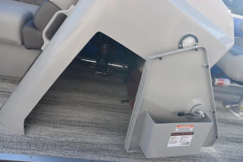 Slide: The Image of 2025 Bennington SX 24 Quad Bench interior detail with storage compartment. - 14