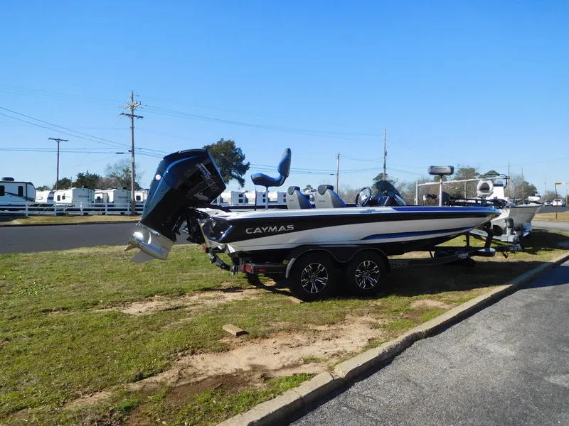 Slide: The Image of 2025 Caymas CX 20 PRO boat on trailer, parked outdoors. - 13