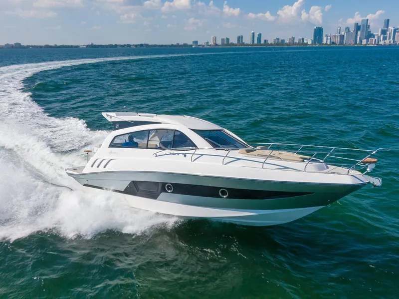Slide: The Image of Luxury Hanover 375 Outboard yacht cruising on open water, 2025 model. - 1
