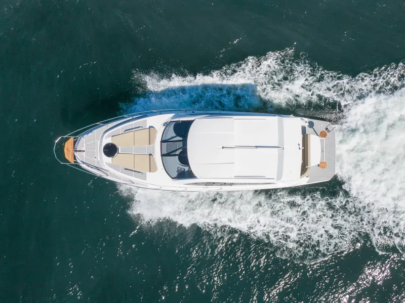 Slide: The Image of Aerial view of 2025 Hanover 375 Outboard yacht cruising on open water. - 3