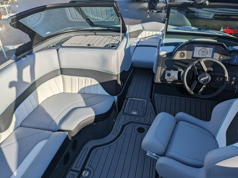 Slide: The Image of 2025 MB B52-21 Alpha boat interior with modern seating and dashboard design. - 6