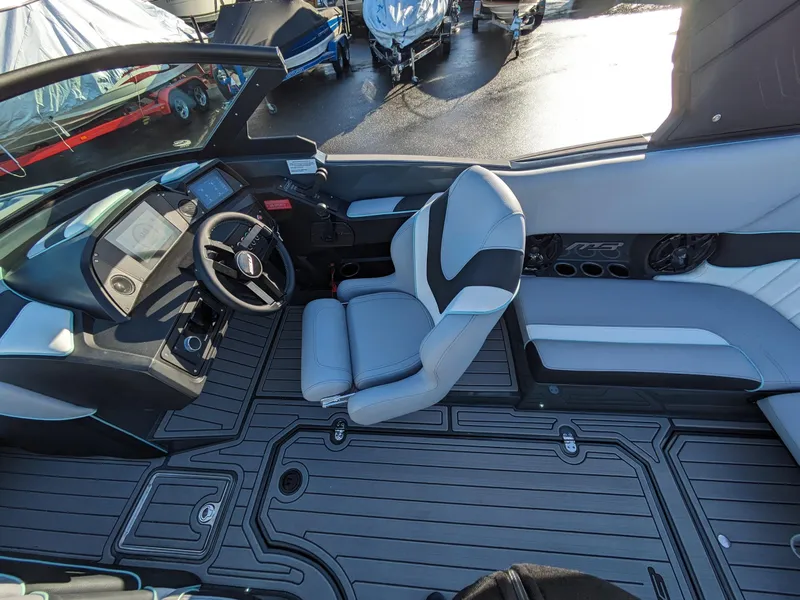 Slide: The Image of 2025 MB B52-21 Alpha boat interior with modern dashboard and seating. - 7