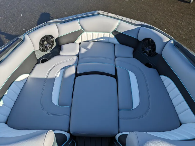 Slide: The Image of Luxurious seating in 2025 MB B52-21 Alpha boat, featuring sleek gray upholstery. - 9