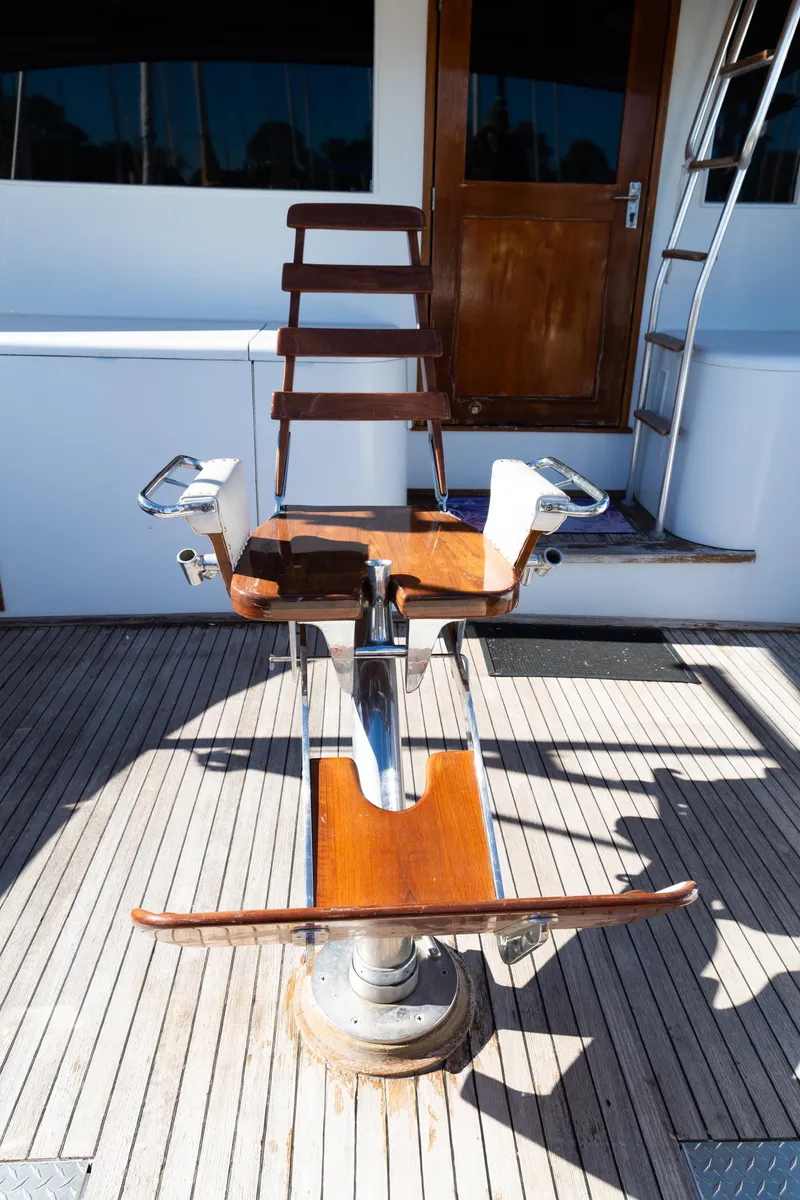 Slide: The Image of Fishing chair on 1987 Buddy Davis 61 Convertible yacht deck. - 10