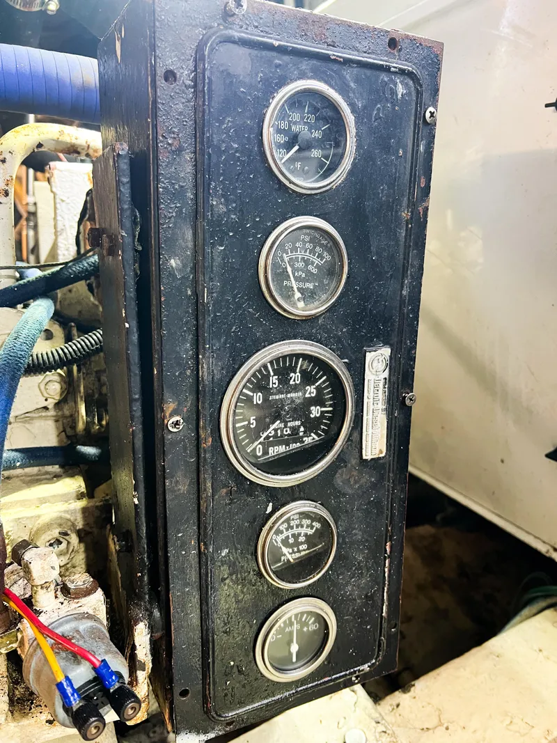 Slide: The Image of Instrument panel of a 1987 Buddy Davis 61 Convertible boat. - 29