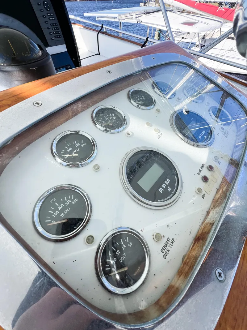 Slide: The Image of Control panel of a 1987 Buddy Davis 61 Convertible yacht with various gauges and dials. - 35