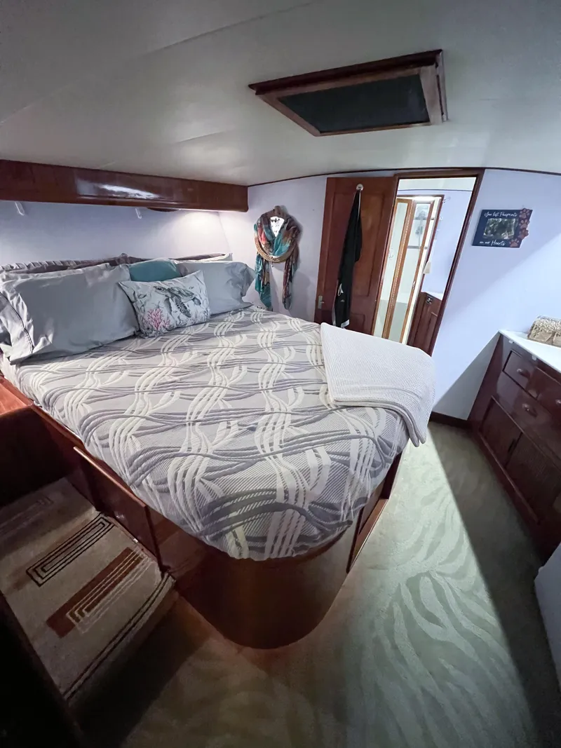 Slide: The Image of Interior of 1987 Buddy Davis 61 Convertible yacht with cozy bedroom and elegant decor. - 45
