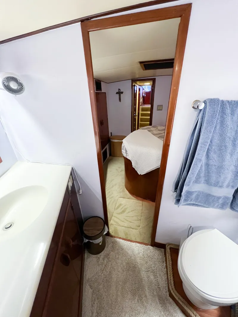 Slide: The Image of Bathroom and bedroom interior of a 1987 Buddy Davis 61 Convertible yacht. - 49