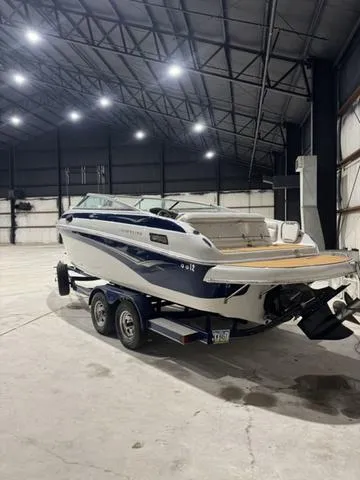 Slide: The Image of 2006 Crownline 236 LS boat on trailer in indoor storage facility. - 3
