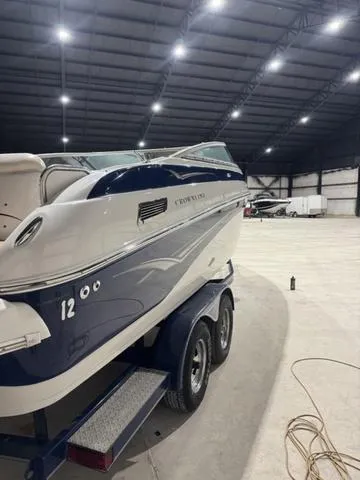 Slide: The Image of 2006 Crownline 236 LS boat on trailer in spacious indoor storage facility. - 4