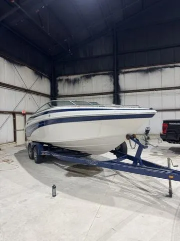 Slide: The Image of 2006 Crownline 236 LS boat on trailer in a warehouse setting. - 5