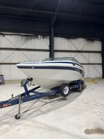 Slide: The Image of 2006 Crownline 236 LS boat on trailer in indoor storage facility. - 6