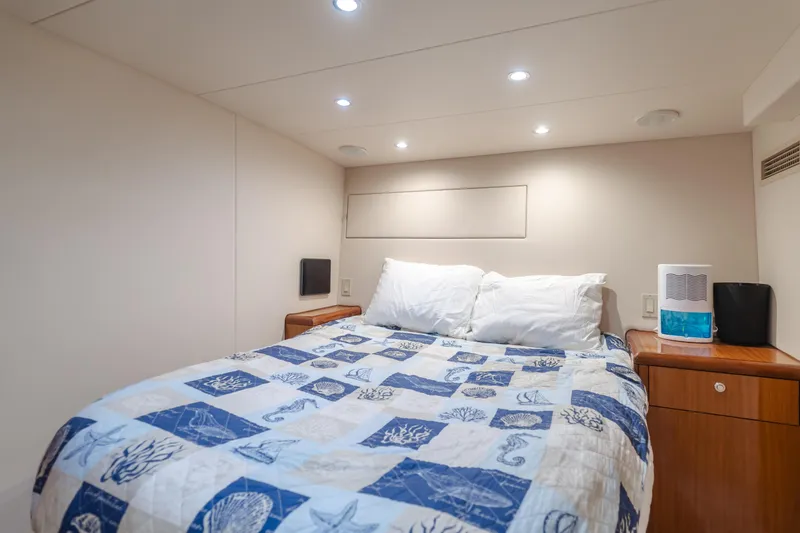 Slide: The Image of Cozy bedroom in 2006 Hatteras 80 Motor Yacht with nautical-themed bedding. - 15