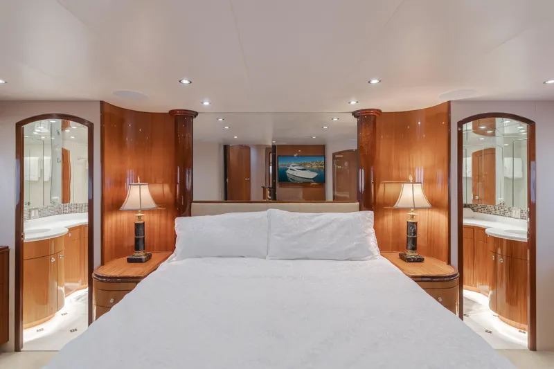 Slide: The Image of Luxurious bedroom interior of 2006 Hatteras 80 Motor Yacht with elegant wood finishes. - 20