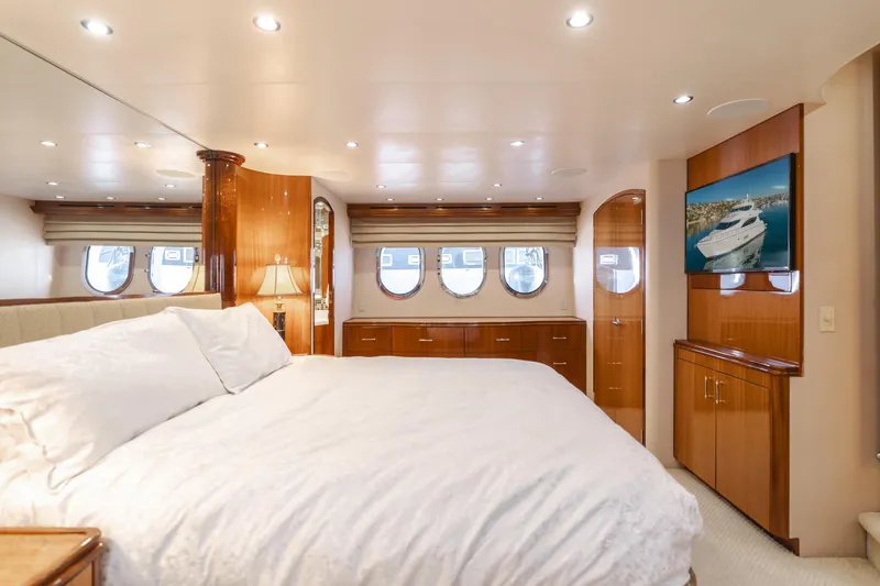 Slide: The Image of Luxurious bedroom interior of 2006 Hatteras 80 Motor Yacht with elegant wood finishes. - 22