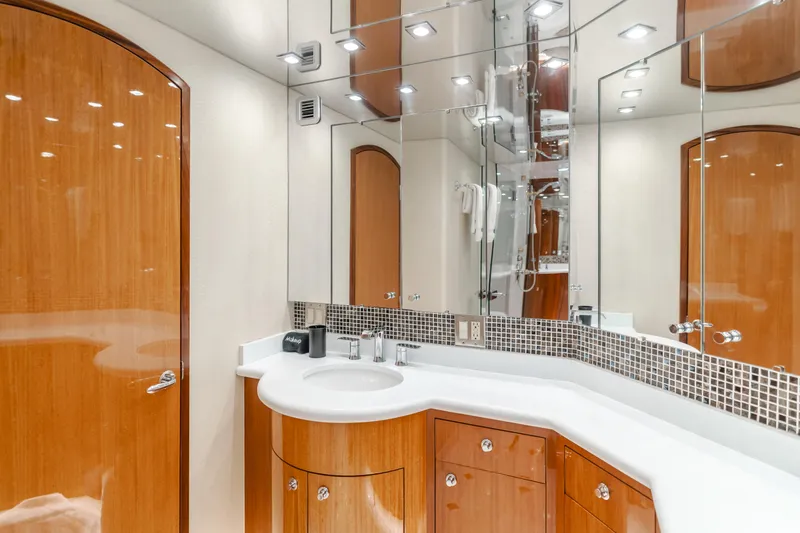 Slide: The Image of Luxurious bathroom in 2006 Hatteras 80 Motor Yacht with wood cabinetry and modern fixtures. - 23