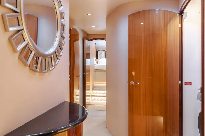 Slide: The Image of Interior hallway of a 2006 Hatteras 80 Motor Yacht with elegant wood finishes. - 26