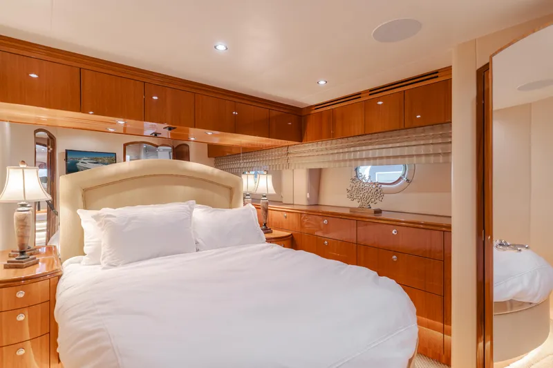 Slide: The Image of Luxurious bedroom interior of 2006 Hatteras 80 Motor Yacht with elegant wood cabinetry. - 27