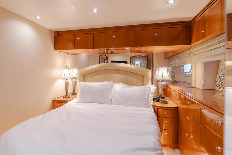 Slide: The Image of Luxurious bedroom interior of 2006 Hatteras 80 Motor Yacht with elegant wood finishes. - 28