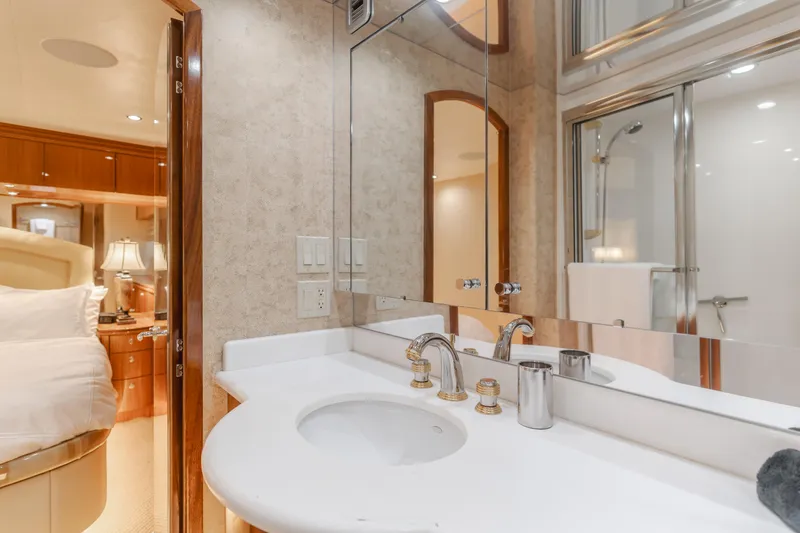 Slide: The Image of Luxurious bathroom in 2006 Hatteras 80 Motor Yacht with elegant fixtures and mirrored walls. - 30