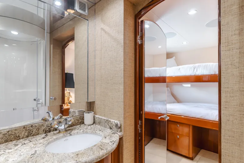 Slide: The Image of Bathroom and bunk beds in 2006 Hatteras 80 Motor Yacht interior. - 34