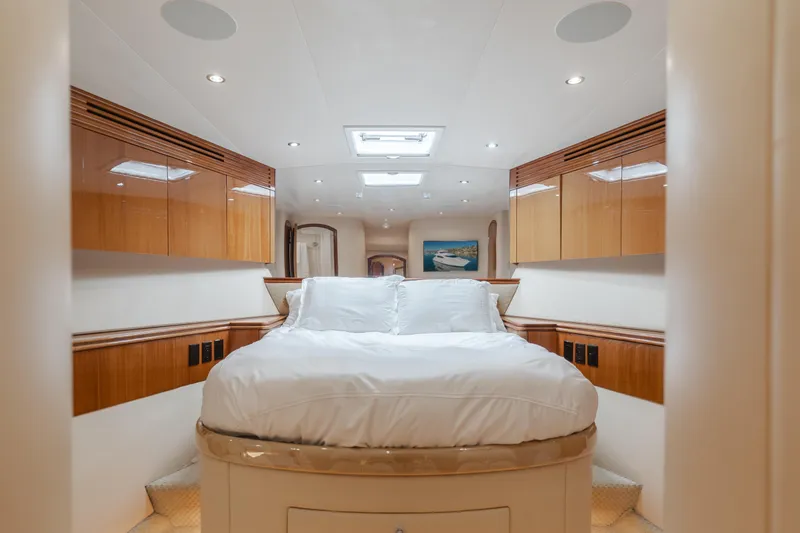 Slide: The Image of Luxurious bedroom interior of 2006 Hatteras 80 Motor Yacht with elegant wood finishes. - 36