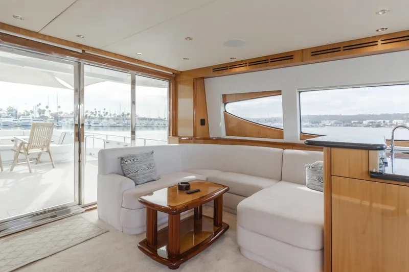 Slide: The Image of Luxurious interior of 2006 Hatteras 80 Motor Yacht with elegant seating and ocean view. - 42